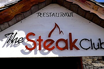 sign saying the steak house