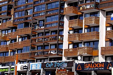 A row of bars with apartments above