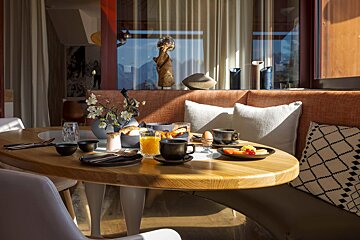 A table with plates of food and drinks on it