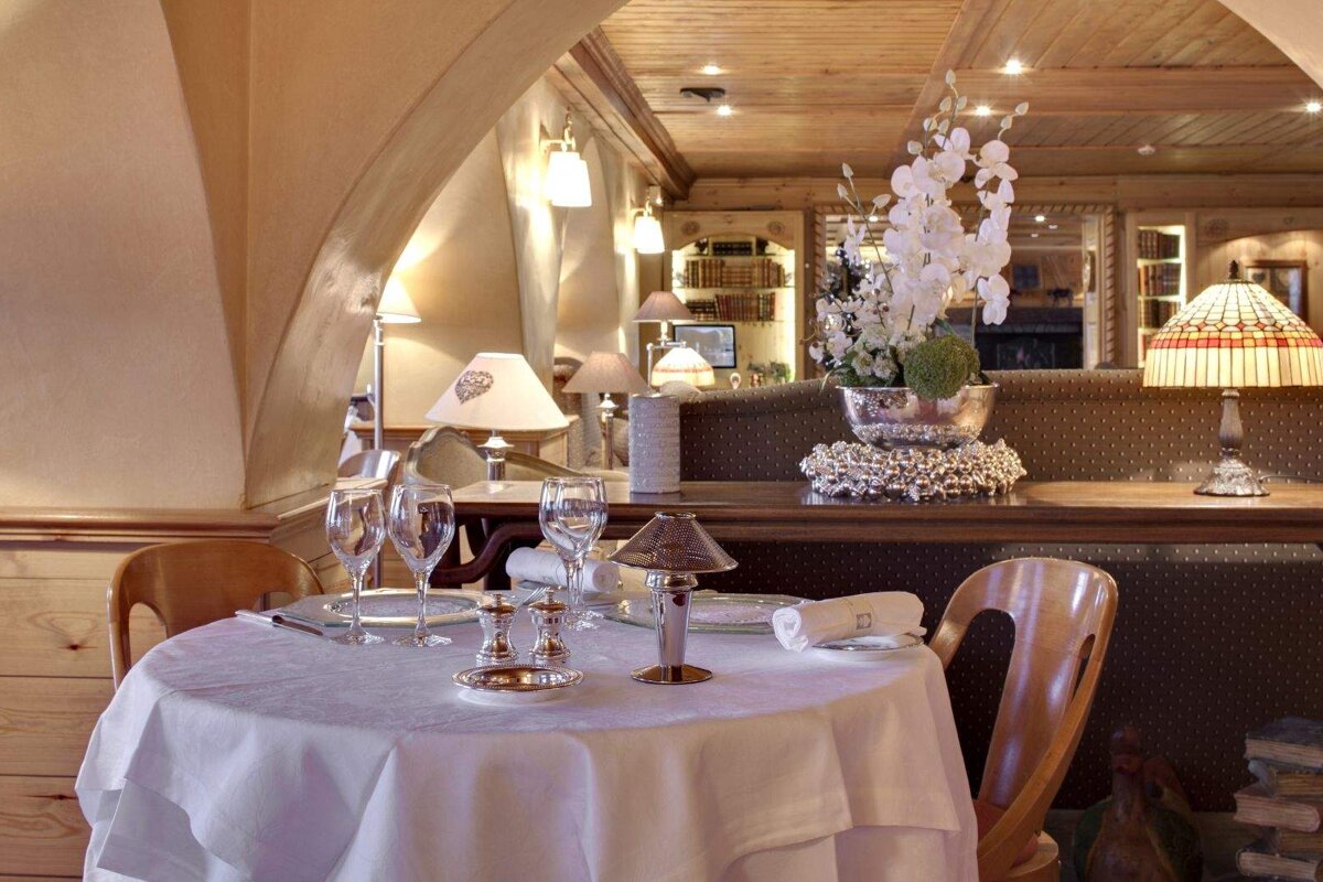 A table in a restaurant with a white table cloth