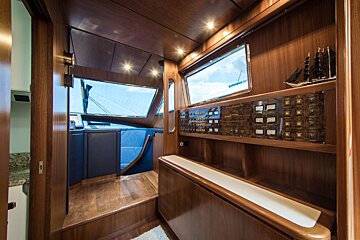 A wooden cabinet with a lot of buttons on it