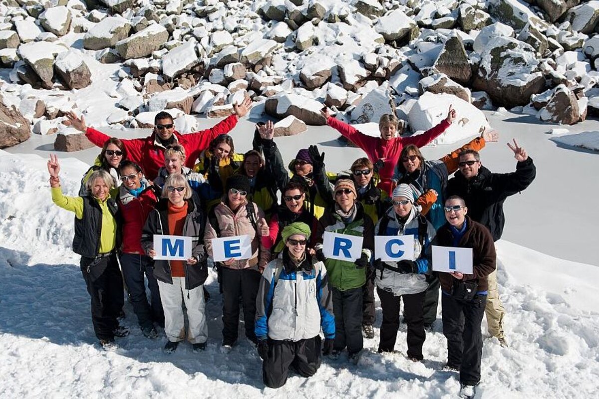 An image of a group of women in the mountains and snow
