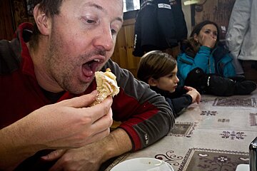 a man eating a cake