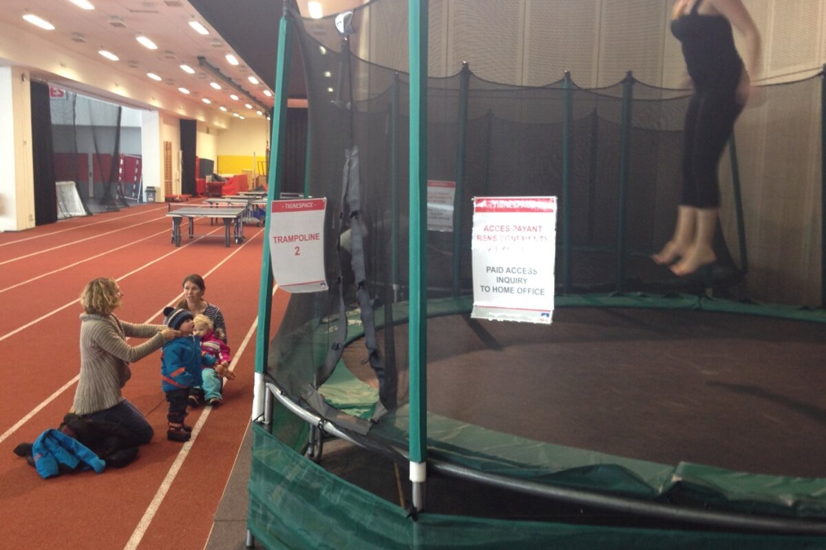 kids waiting outside a covered trampoline