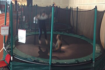 two people bouncing on the same trampoline
