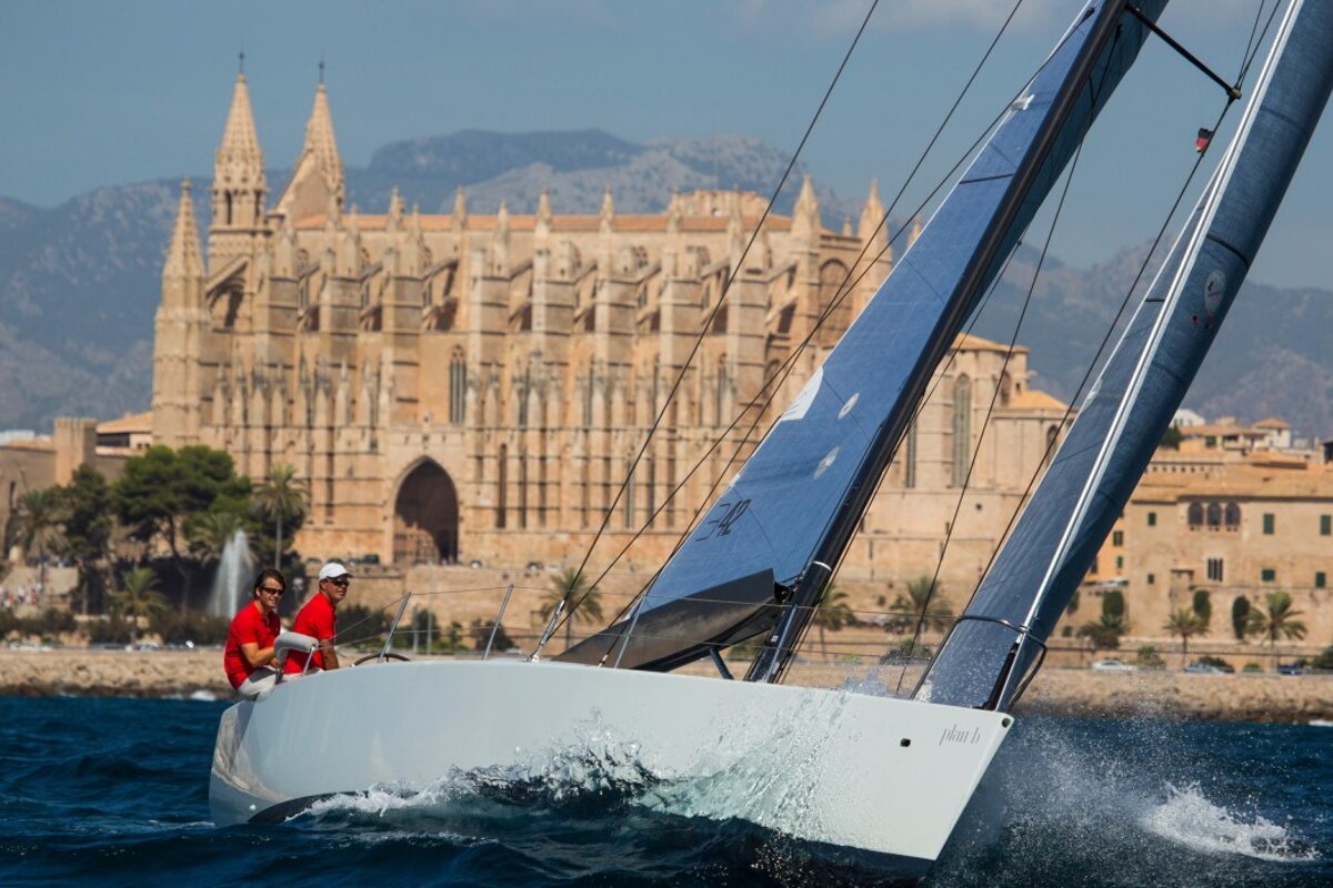 a yacht in front of Palma cathedral mallorca
