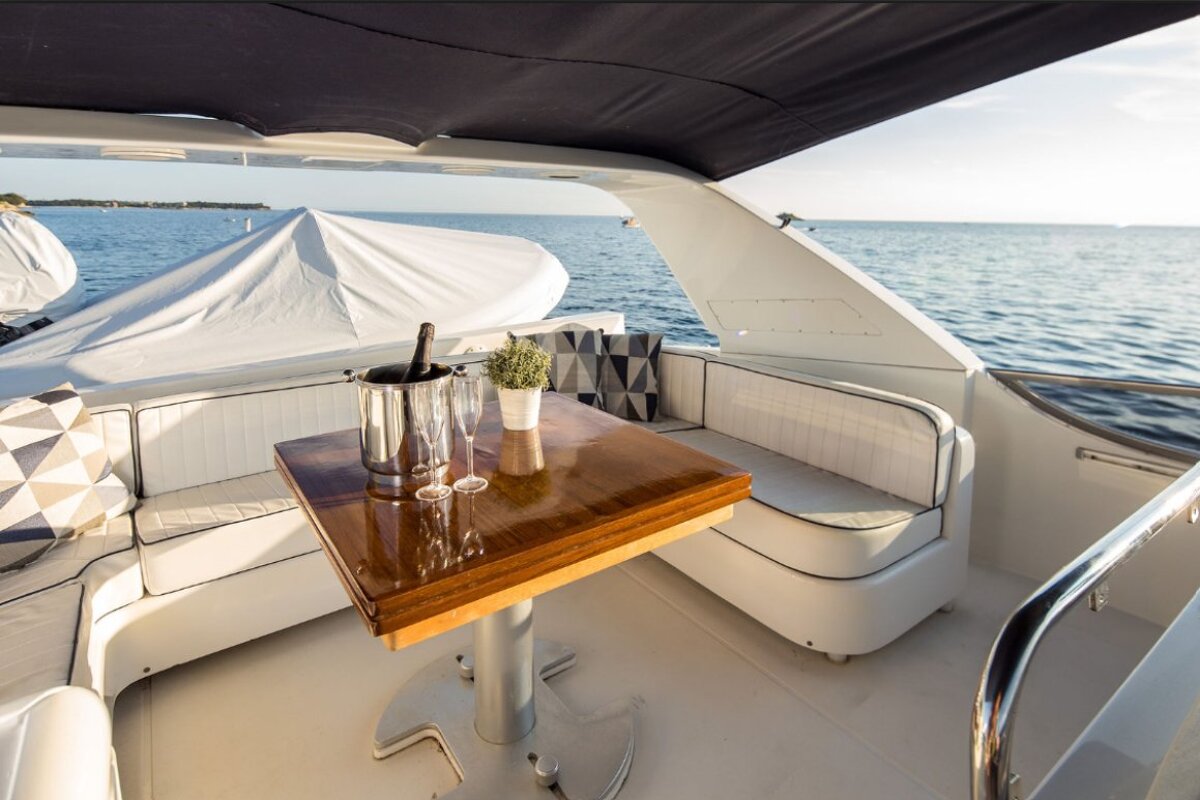 A table with two glasses and a bottle of champagne on it