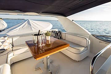 A table with two glasses and a bottle of champagne on it