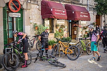 A man in a pink shirt with the number 8 on it