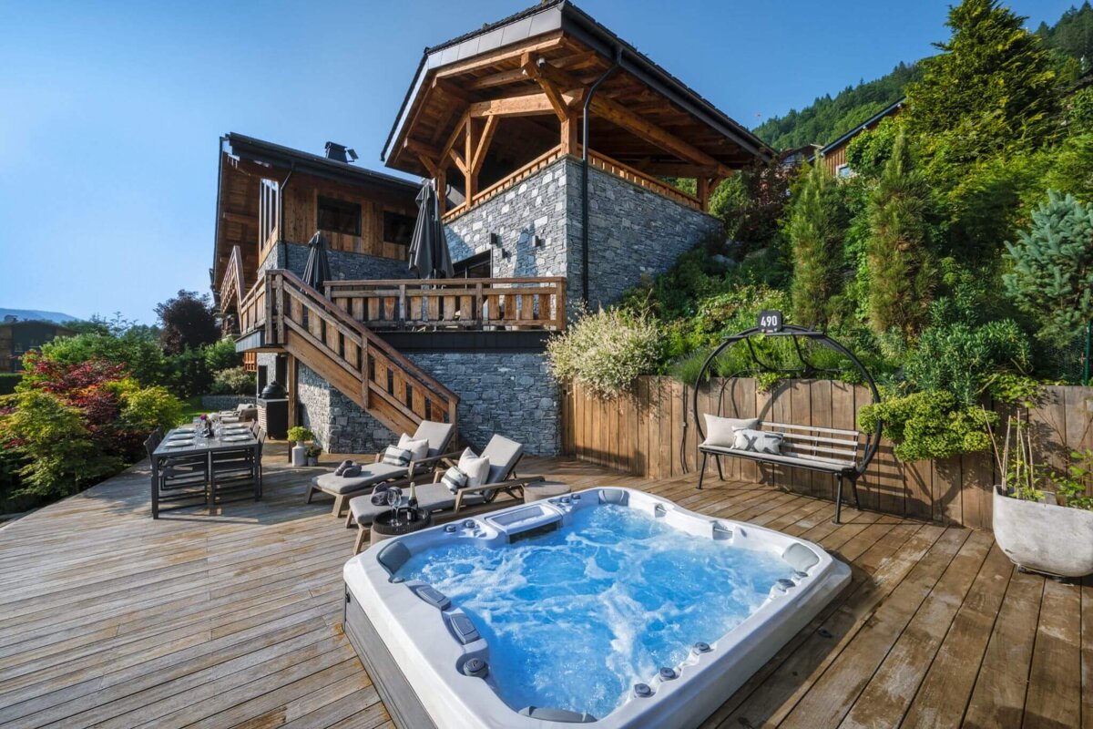 A large house with a hot tub in front of it