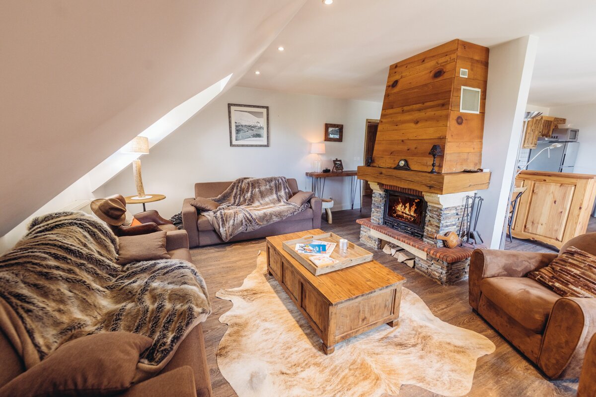 A living room with a fireplace and a couch