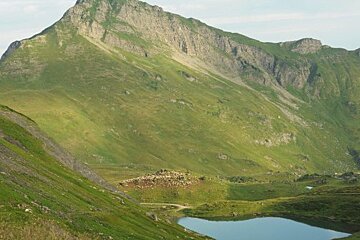 A mountain with a lake in the middle of it