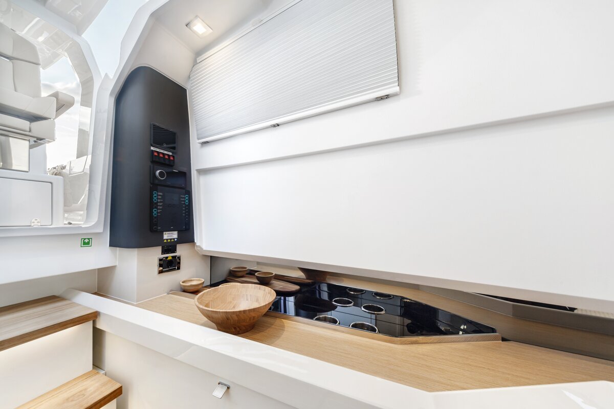 A wooden bowl sits on a counter in a kitchen
