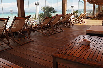 deck chairs lined up in a beach restaurant