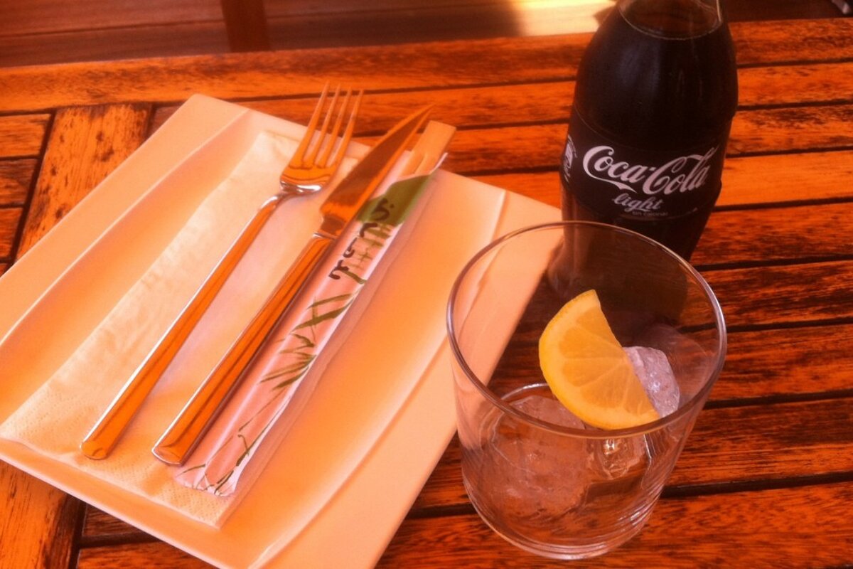 a plate with a choice of forks or chop sticks