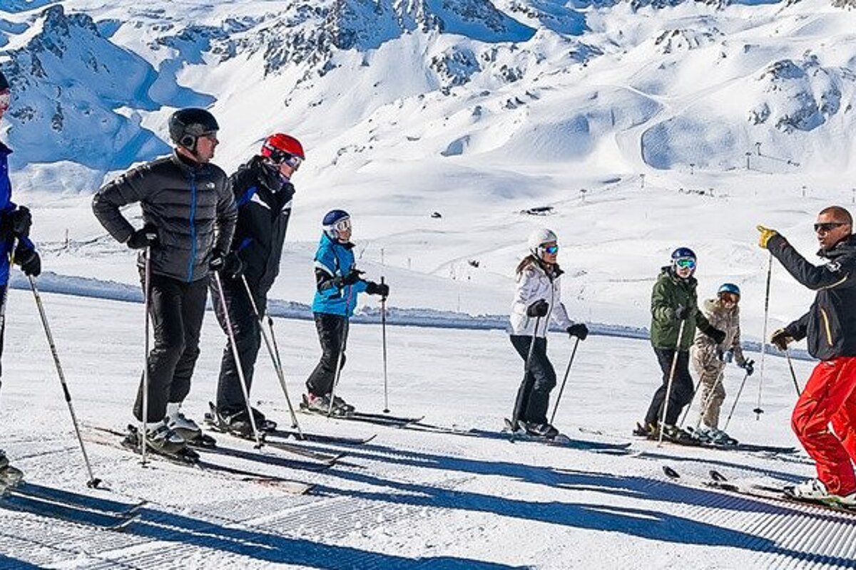 a ski instructor giving a group lesson