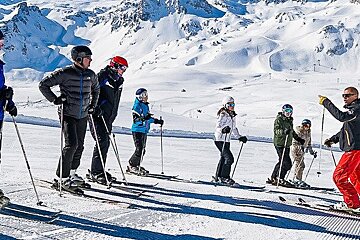 a ski instructor giving a group lesson