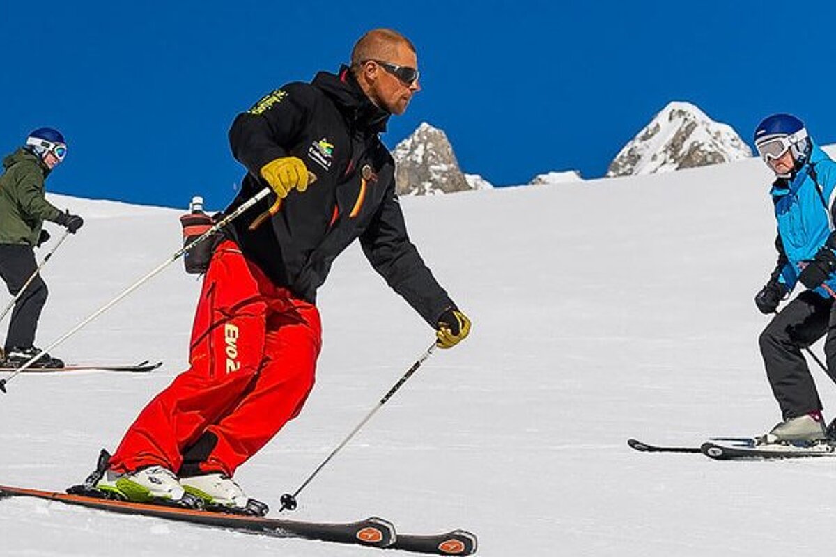 a ski instructor giving a group lesson