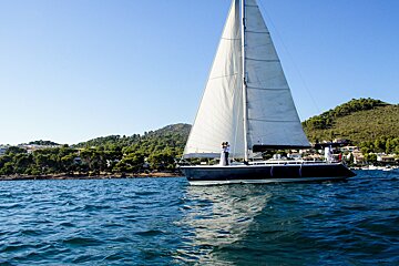 A sailboat is floating on a body of water