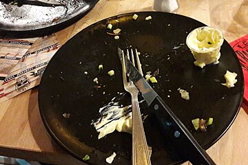 a black plate knife & fork