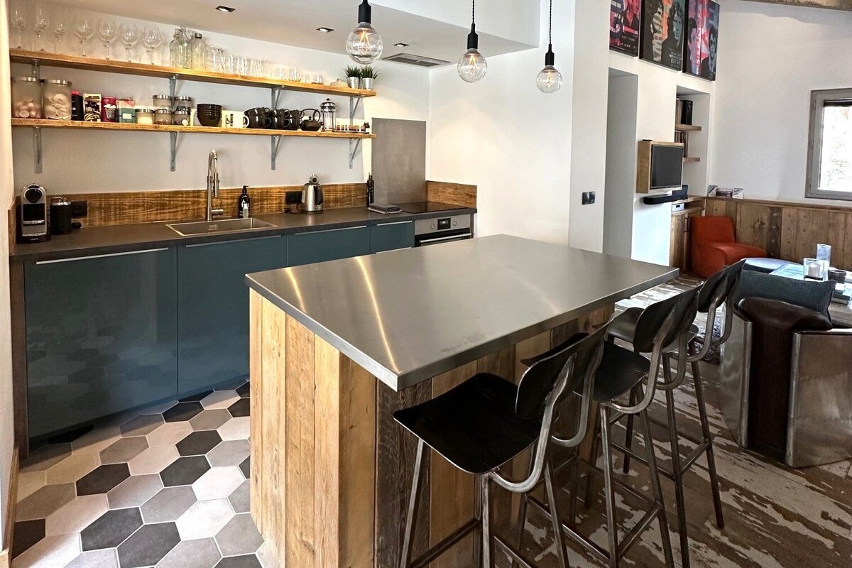 A kitchen with a stainless steel counter top