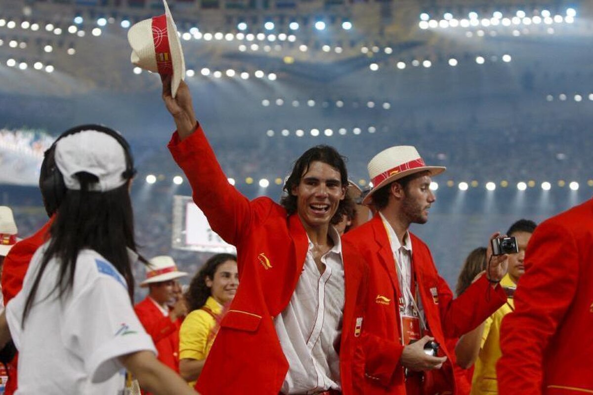 A man in a red jacket with the word spain on it