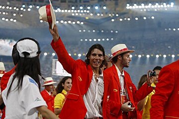 A man in a red jacket with the word spain on it