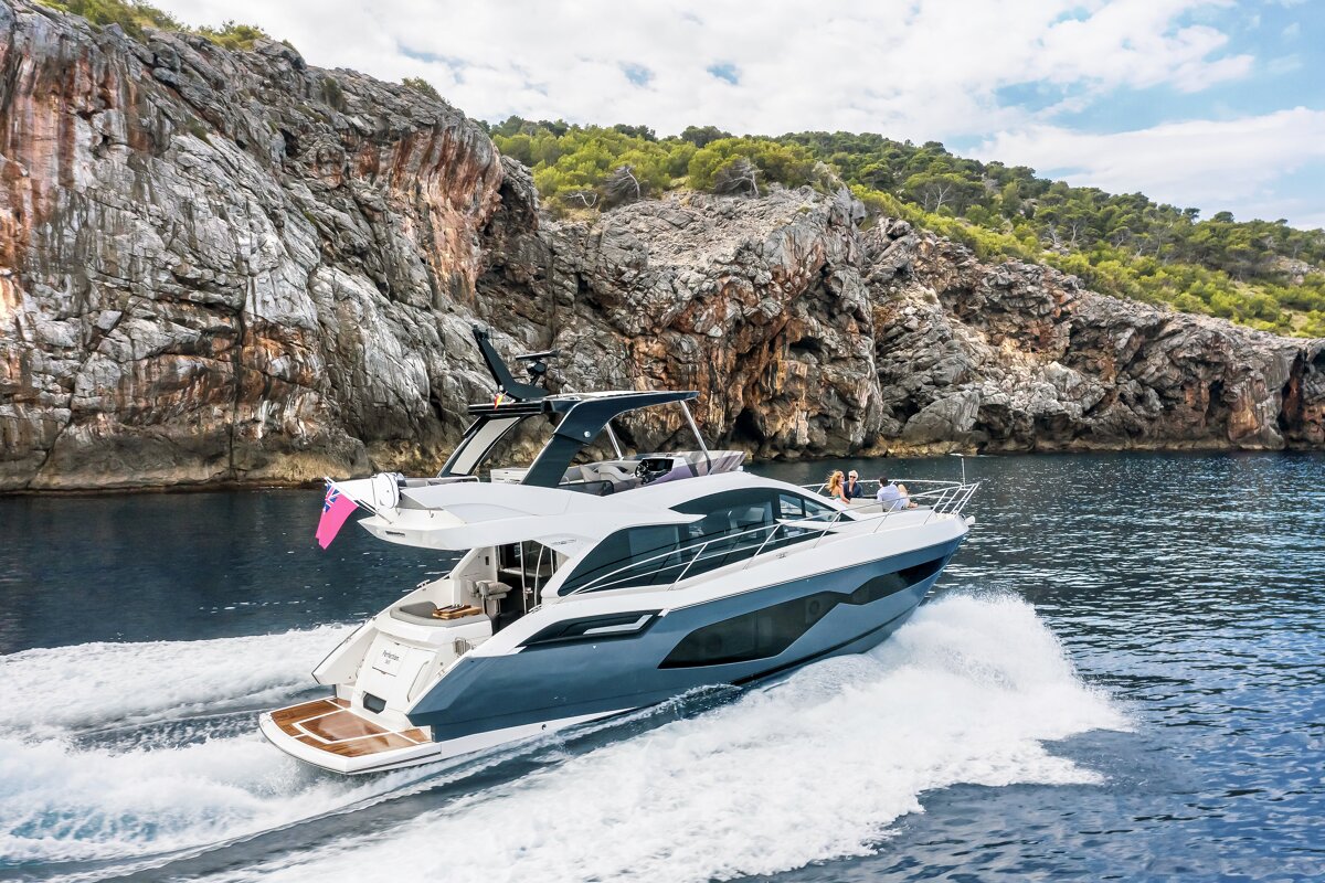 A boat with a british flag on the back of it