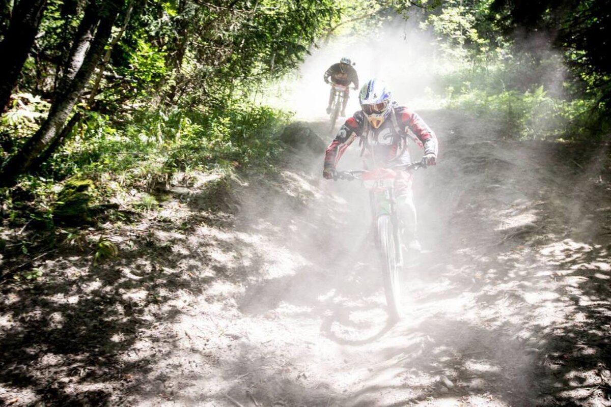 A person riding a bike with the number 88 on it