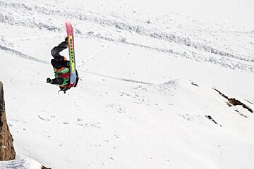 a snowboarder doing a backflip