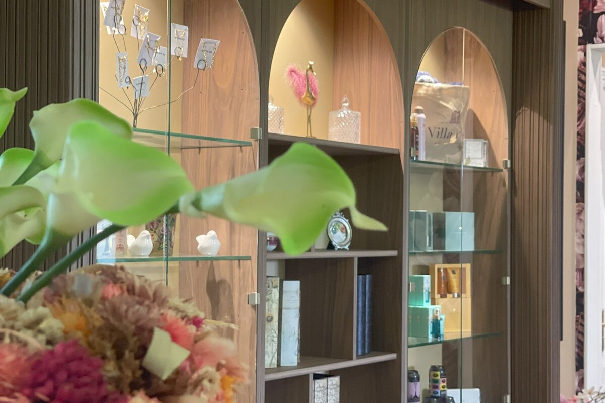 A shelf with a clock on it that says valley