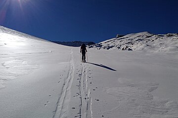 a man ski touring
