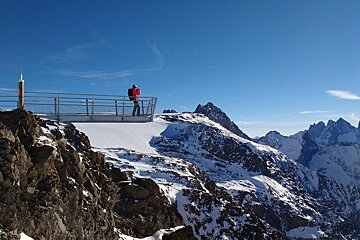 a man standing on an overhanging ledge