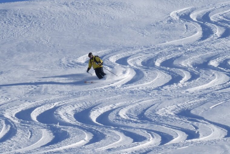 a skier in parallel tracks