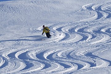 a skier in parallel tracks