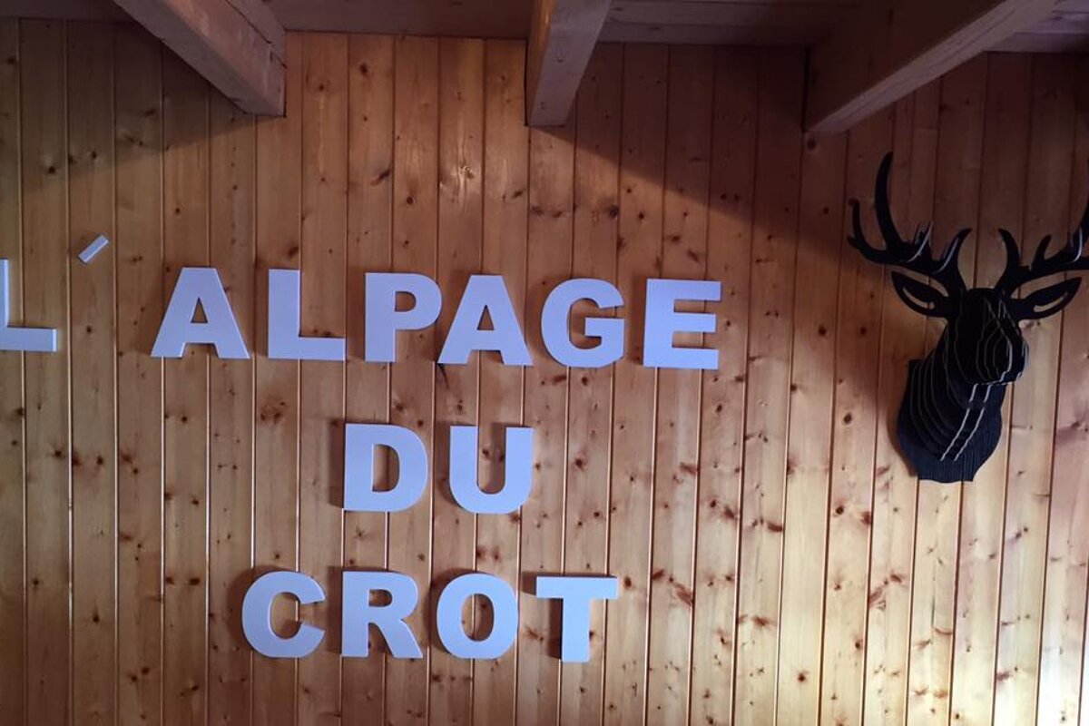 L' alpage du crot is written on a wooden wall