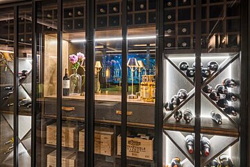 A wine cellar with bottles of wine and a crate that says ' stable ' on it