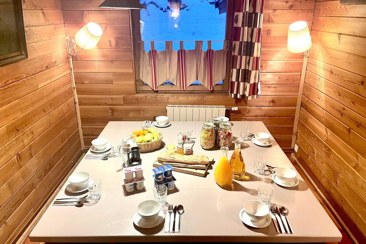 A table with a bottle of orange juice on it