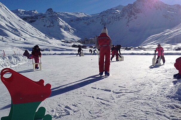 people skating in the sunshine