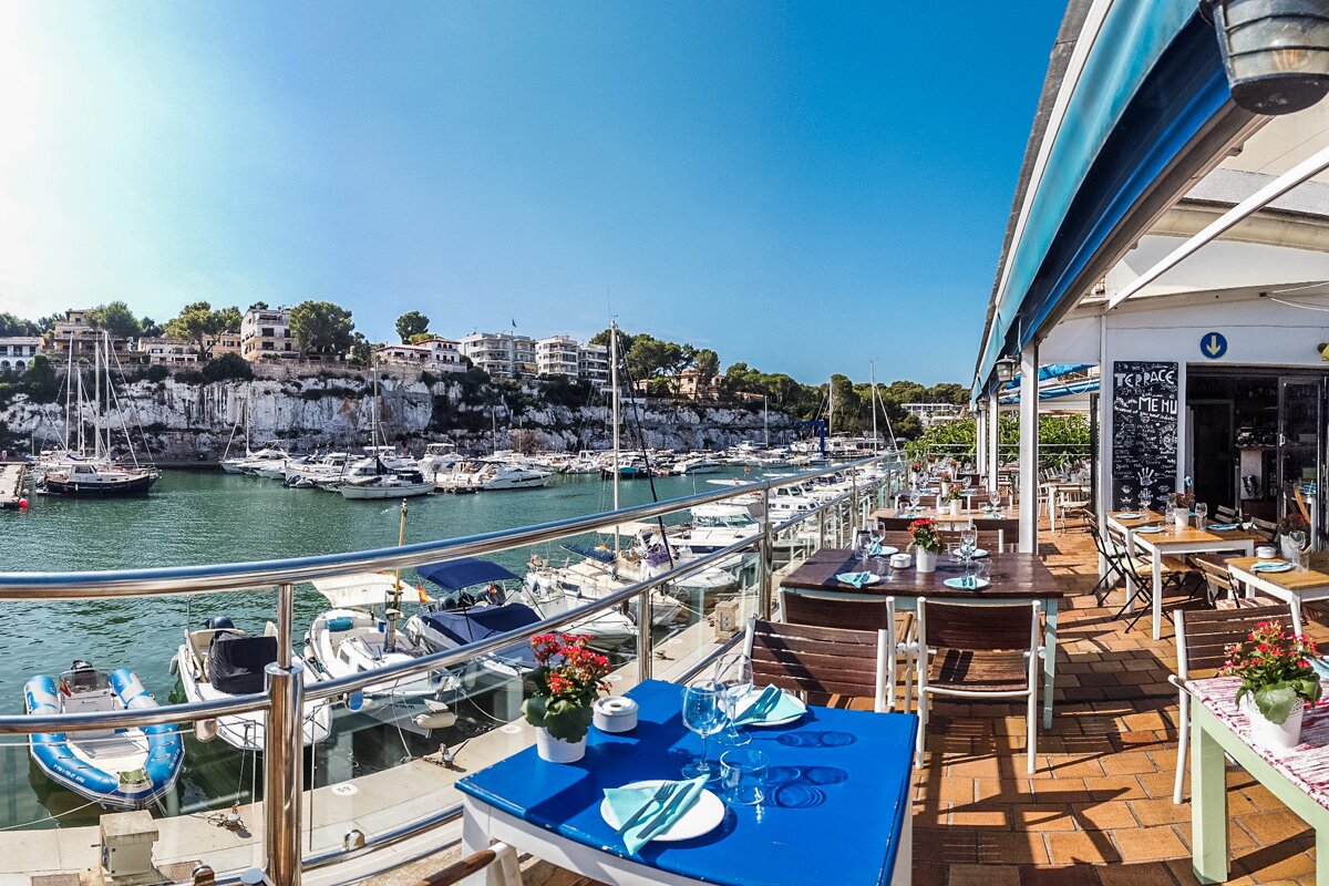 The terrace at Quince restaurant overlooling the harbour of Porto Cristo