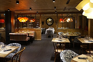 the interior of a smart looking restaurant
