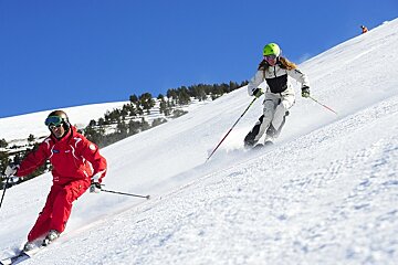a ski instructor giving a private lesson