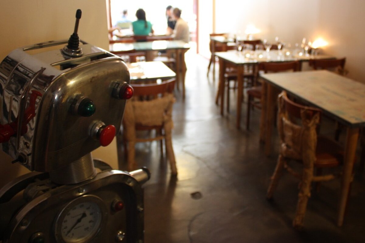 a retro robot in a restaurant in provence