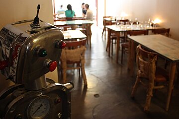 a retro robot in a restaurant in provence