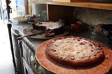 two cakes on a counter in a restaurant