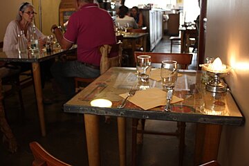 small dining tables inside a restaurant