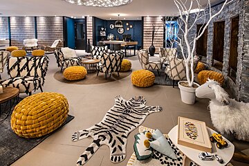 A room with a tiger rug on the floor