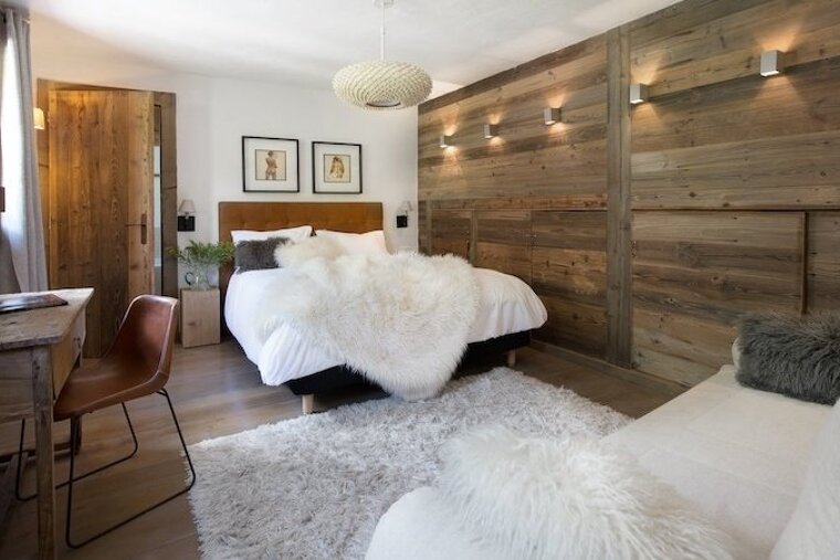 a bedroom with a furry throw