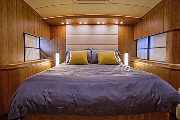 There is a large bed in the middle of the room
