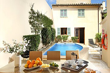 A house with a swimming pool in the backyard